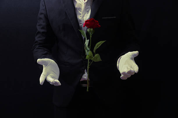 Magician floating rose Magician floating rose performance magic show stock pictures, royalty-free photos & images