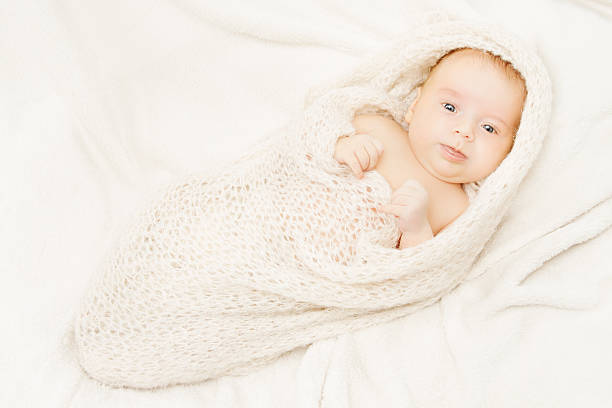 istock newborn baby covering in soft woolen blanket 475530867
