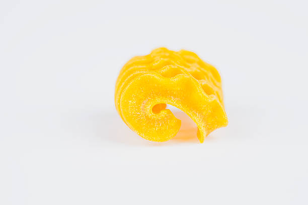 istock Uncooked pasta, yellow accordion noodle 475533104