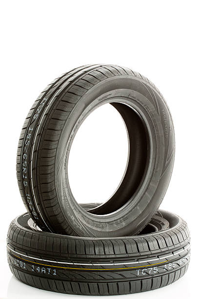 istock New car tires against white background 475533242