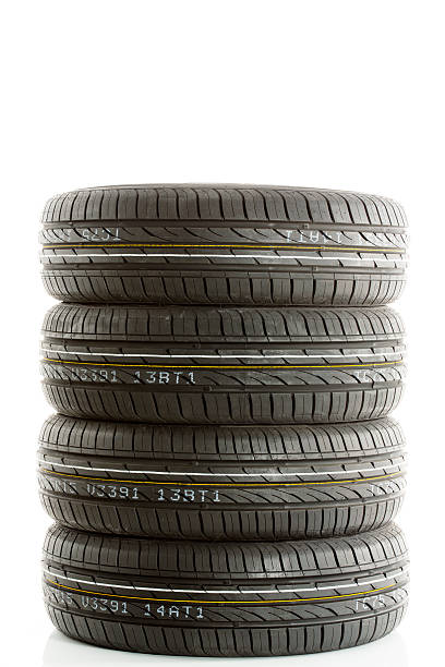 istock New car tires against white background 475533262