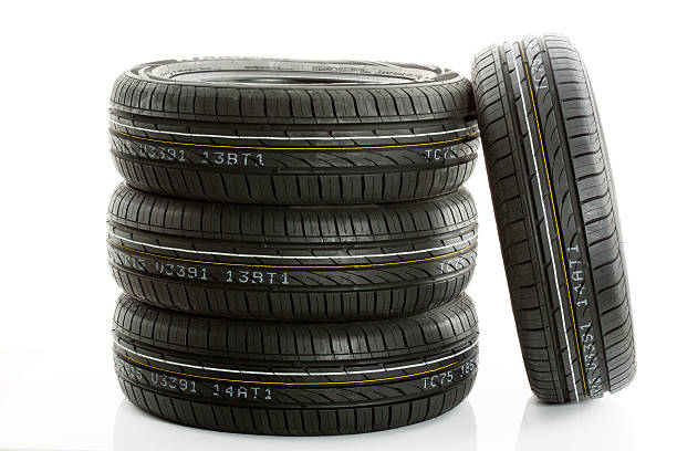 istock New car tires against white background 475533264