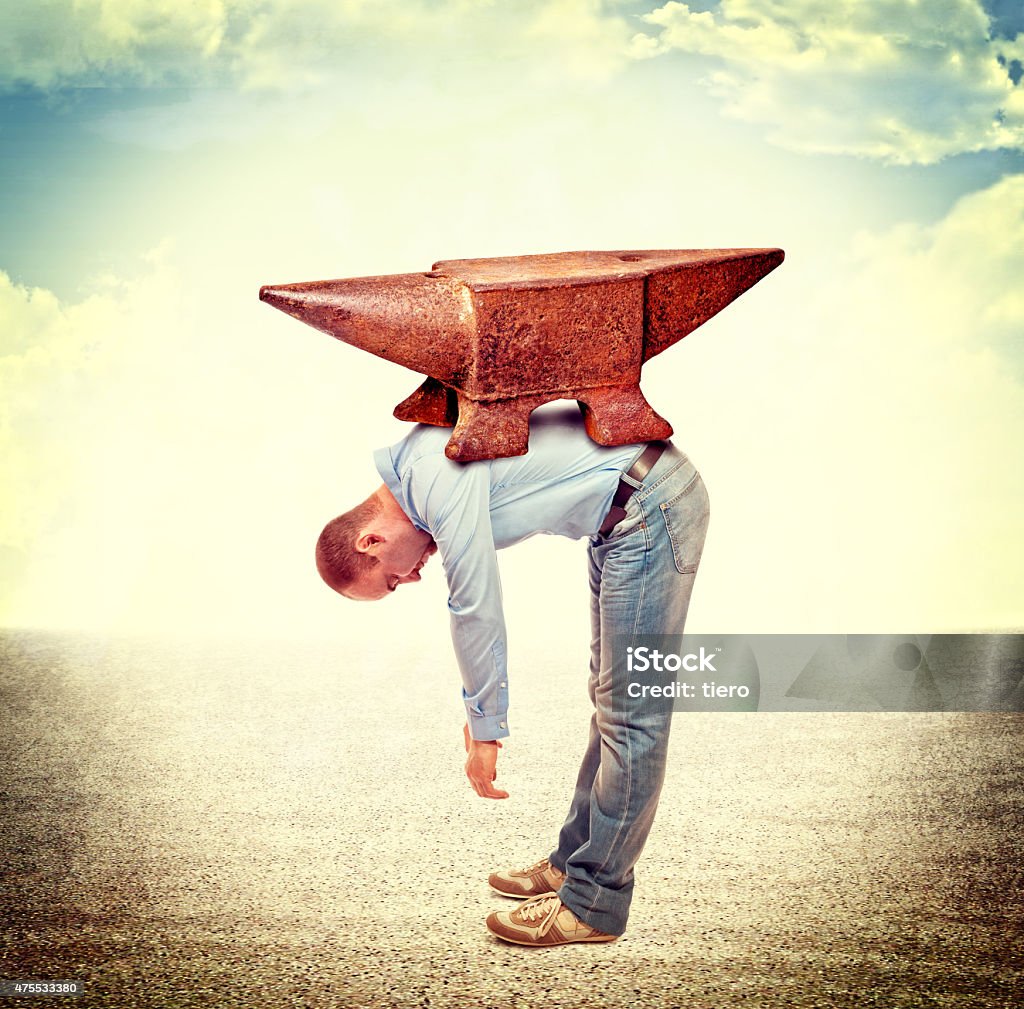 heavy stress businessmanwith huge anvil on his back 2015 Stock Photo