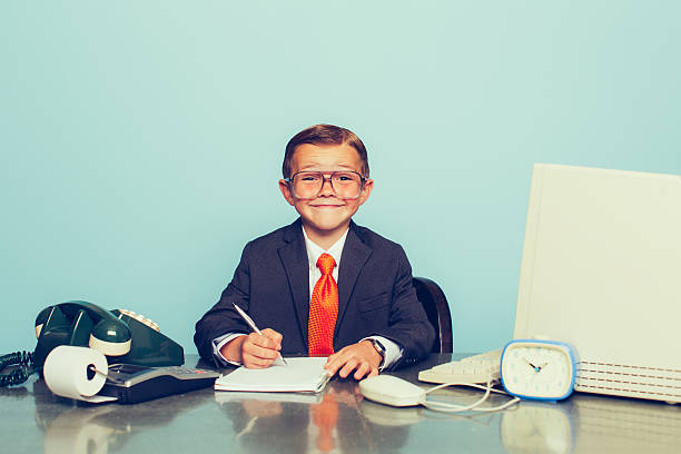istock Young Boy Businessman Working at the Office 475537100