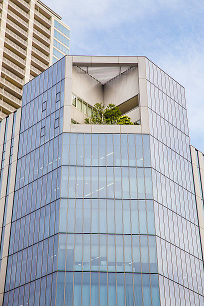 istock skyscraper with garden at top against a cloudy sky 475537236