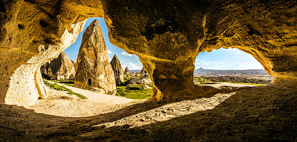 Cappadocia, Turkey View of rock formation from carved cave in Rose / Red valley in Cappadocia, Turkey rose valley stock pictures, royalty-free photos & images