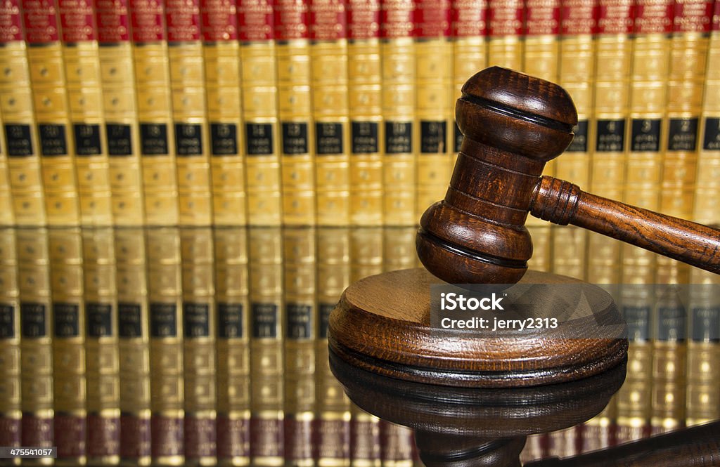 Justice gavel Justice Gavel with law books in the background Advice Stock Photo