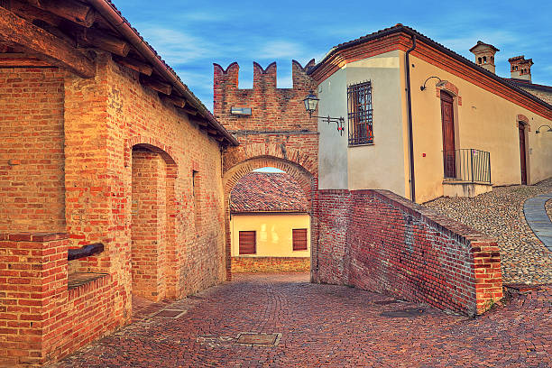 Narrow cobbled street in old historic center of Monticello D'Alba - small town in Piedmont, Northern Italy.