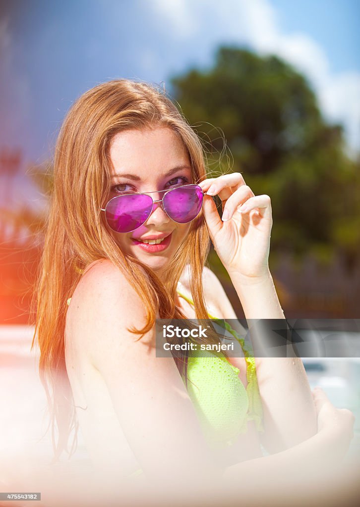 Beautiful teenage girl at the swimming pool 2015 Stock Photo