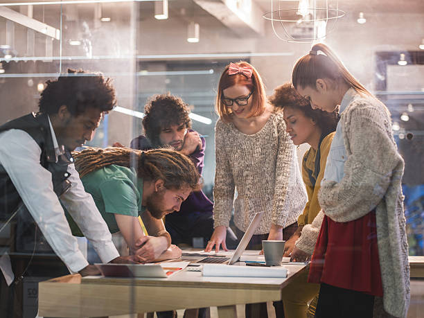 istock Team of young creative people working in the office. 475543288