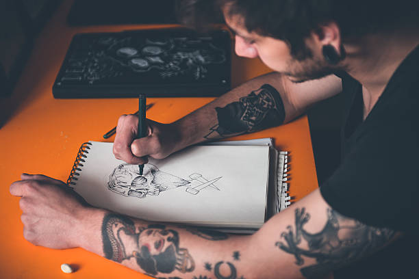 Tattoo Artist Drawing stock photo