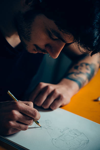 istock Tattoo Artist Drawing 475543600