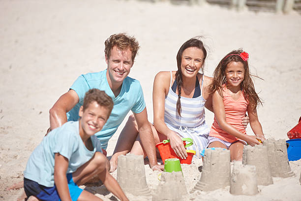istock Making a family masterpiece out of sand 475544164