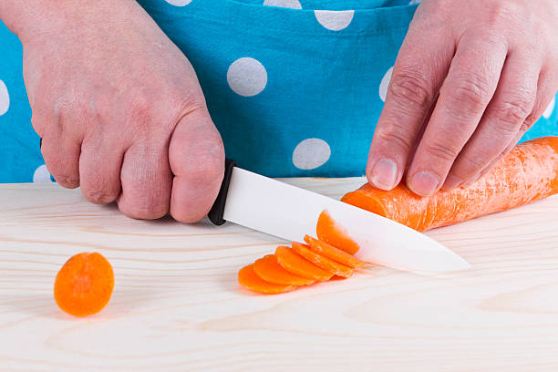 istock Housewife chopping carrot 475544453