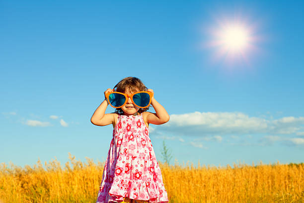 istock Happy little girl with big sunglasses 475545607
