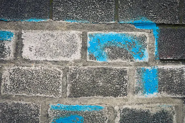 Blue paint on a brick wall as a background image