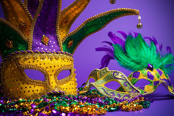istock Assorted Mardi Gras or Carnivale masks on a purple background 475548275