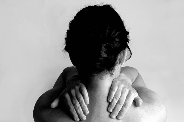 istock woman with  pain shoulder 475548430