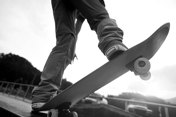 istock skateboarding legs at skatepark 475550554