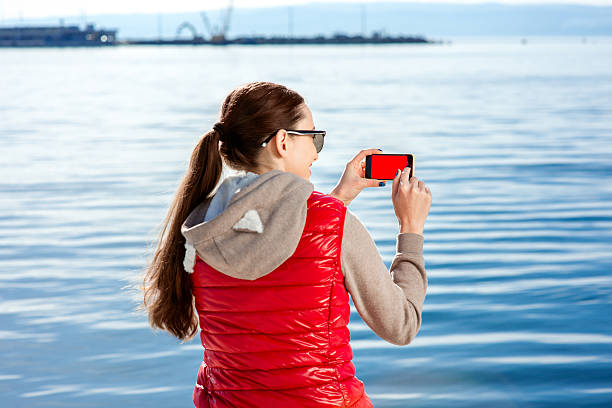 sport frau auf die promenade - women sweater vest beach pier stock-fotos und bilder