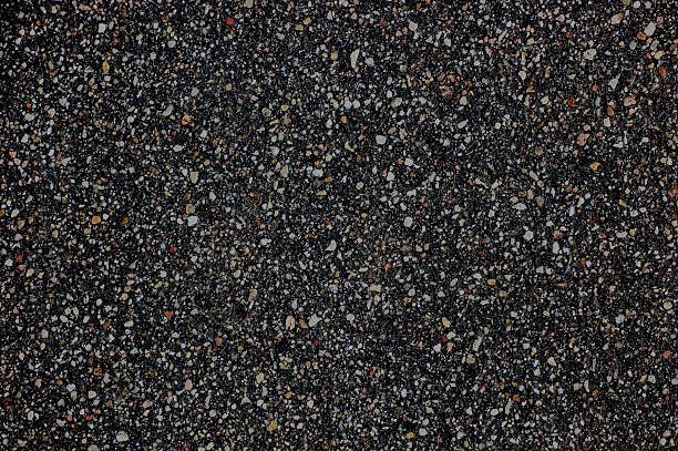 istock Detailed Wet Asphalt Texture, large horizontal tarmac textured background pattern 475558789