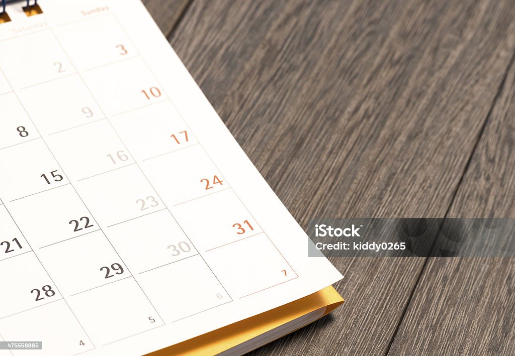 Daily plans. Calendar with file on Wooden Desk.Shot with Nikon D800E ISO100. Calendar Stock Photo