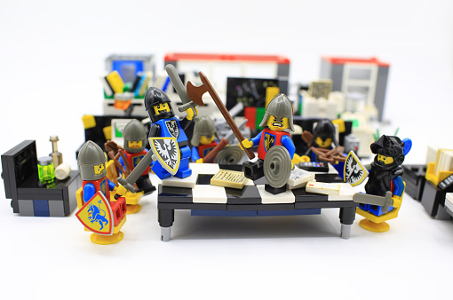 Hong Kong, Сhina - March 27, 2015:  Studio shot of Lego people in office, combine from different set. Legos are a popular line of plastic construction toys manufactured by The Lego Group in Denmark