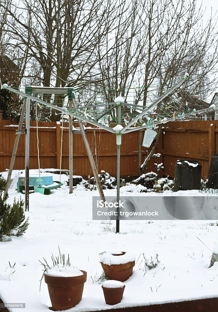 Garden in the snow Snow falling in a home garden in the UK Agreement Stock Photo