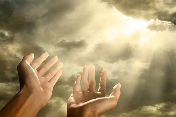 Photo of Hands reaching for the sky