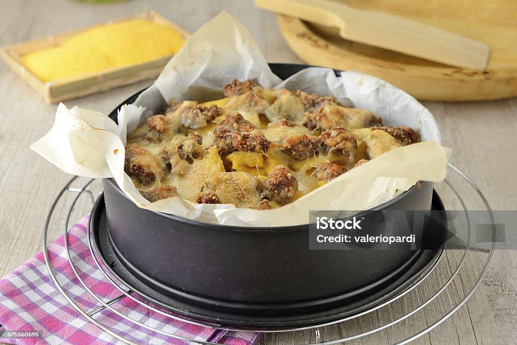 Polenta with melted cheese and sausage Italian polenta with melted cheese and sausage Backgrounds Stock Photo