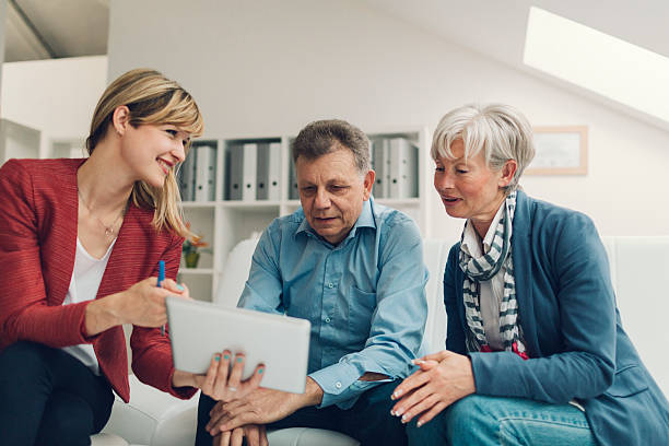 istock Mature Couple Meeting with Financial Advisor. 475563226