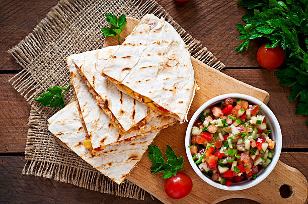 Mexican Quesadilla wrap with chicken, corn and salsa stock photo