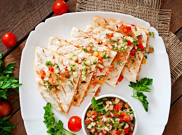 istock Mexican Quesadilla wrap with chicken, corn and salsa 475563314