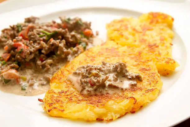 Potato pancakes with minced meat sauce