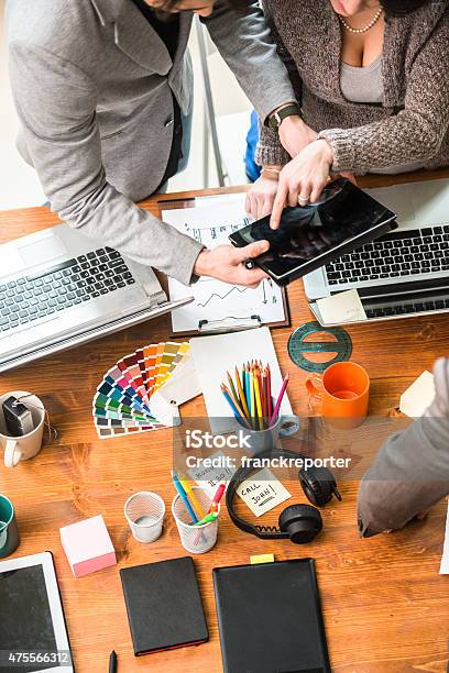 Team Coworking In The Office Stock Photo - Download Image Now - Graphic Designer, Breaking New Ground, Innovation