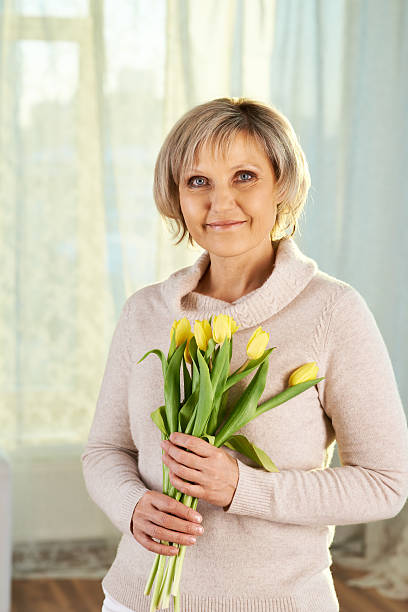 istock Woman with tulips 475566597