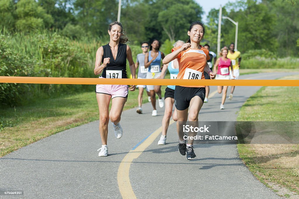 Runners Diverse group of runners competing in a race. Cross-Country Running Stock Photo