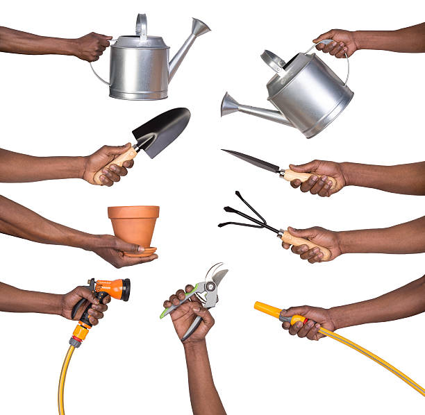 Man holding gardening tools Man holding gardening tools watering can photos stock pictures, royalty-free photos & images