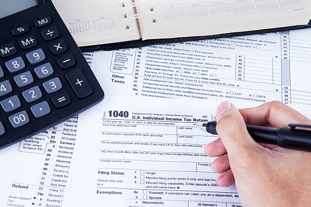 istock Filling the tax form 475574903