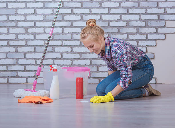 istock girl washes the floors 475576404