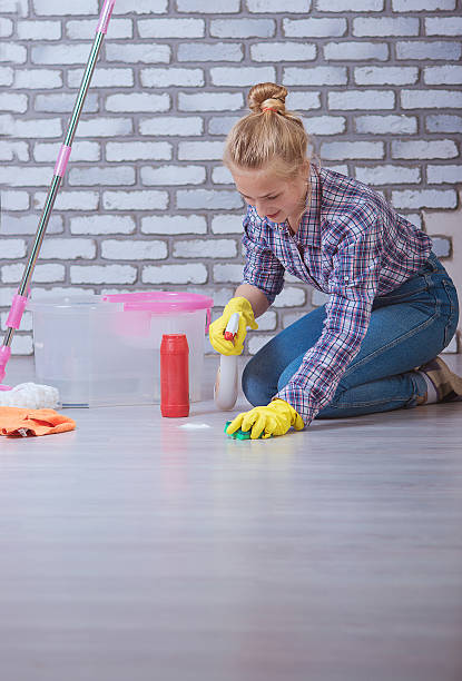 istock girl washes the floors 475576406