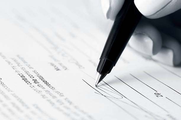 istock Businesswoman signing contract 475580366