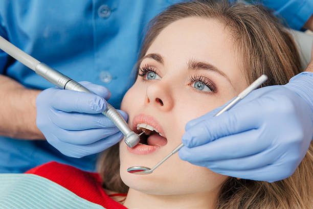 istock Woman having teeth examined at the dentist 475582958