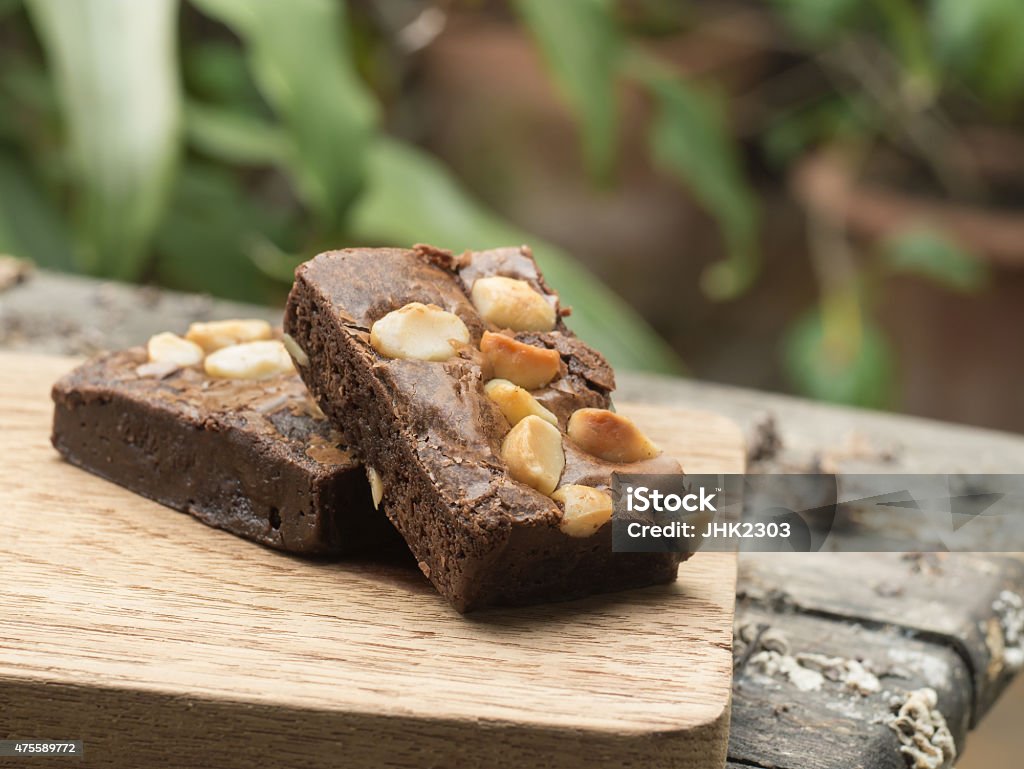 Cake Chocolate brownie on a wooden plate Brownie Stock Photo