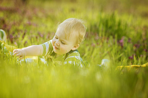 istock Boy on a green lawn 475592356