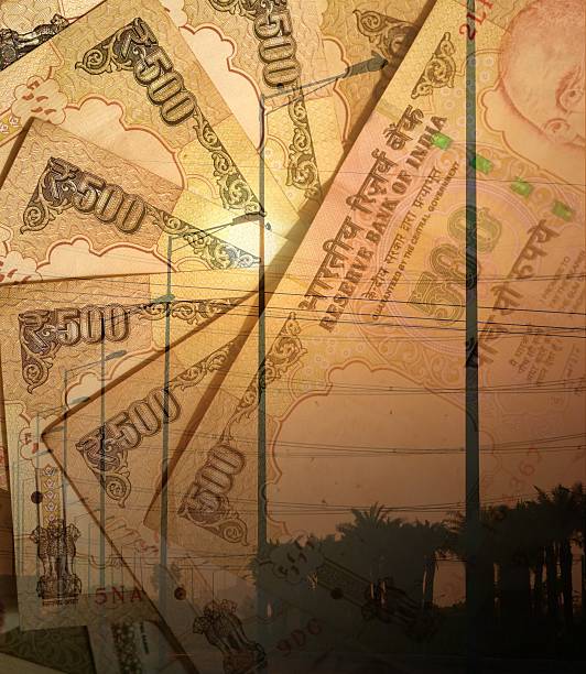 istock Electric street lamps and Indian 500 Rupee notes 475593224