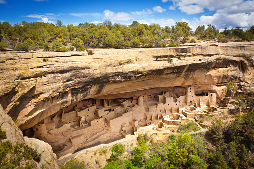 The cliff dwelling of Ancient Pueblo in Mesa Verde National Park of Colorado, southwest USA. The Cliff Palace features various adobe building structures on the face of the cliff in Mesa Verde National Park with living quarters, community space, storage areas, and spiritual kivas, beautifully conceived architectural were built by the ancient Pueblo tribes.