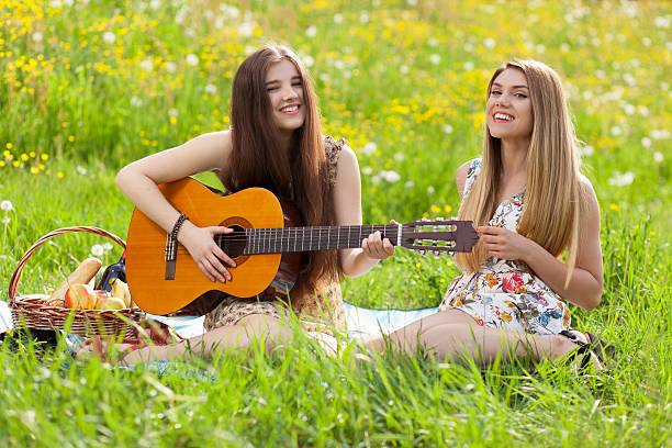 istock Two beautiful young women on a picnic 475602612