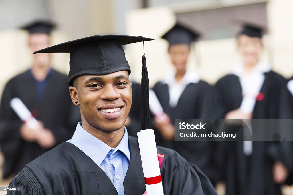 african male university graduate happy african male university graduate with classmates Graduation Stock Photo