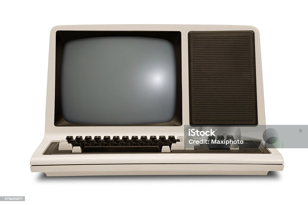 Vintage old computer, rounded monitor, keyboard, eighties revival, white background Vintage old computer from the eighties, with integrated monitor and keyboard. Retro revival style with rounded corners, front low angle view,  isolated on white background with clipping path. Computer Stock Photo